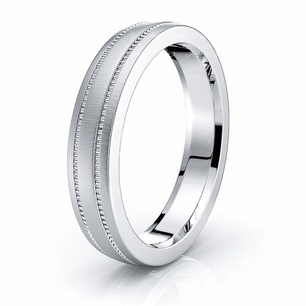 Plain white gold wedding band on a ring dish